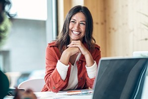 Woman smiling during meeting in office