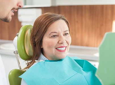 Woman smiling in the dental chair