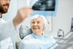 dentist showing patient her X-ray