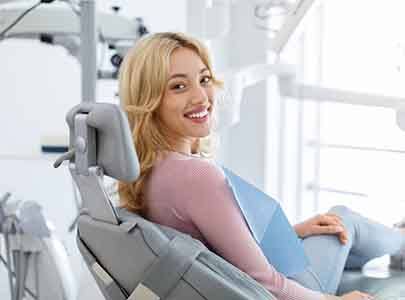 Woman happy about receiving periodontal therapy