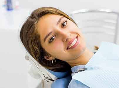 Woman smiling after receiving antibiotic treatment