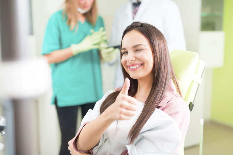 Patient smiling with their new CEREC crowns