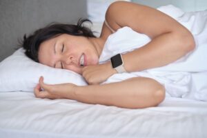 Woman grinding and clenching her teeth during sleep