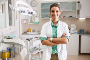 Dentist posing in her treatment room